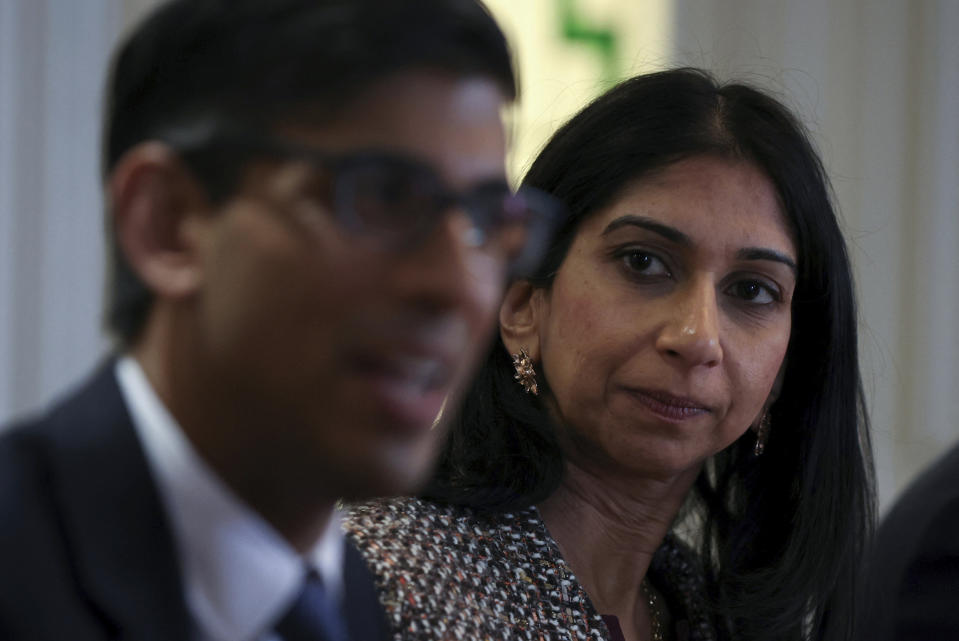 Britain's Prime Minister Rishi Sunak, left, and Britain's Home Secretary Suella Braverman, attend a meeting with the local community and police leaders following the announcement of a new police task force to help officers tackle grooming gangs, in Rochdale, England, Monday, April 3, 2023. (Phil Noble/Pool Photo via AP)