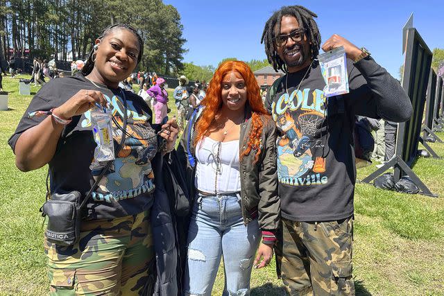 <p>William Perry</p> Concertgoers display naloxone nasal sprays at a North Carolina festival in 2023.