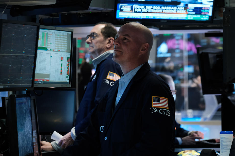 NEW YORK, NEW YORK - MARCH 28: Traders work on the floor of the New York Stock Exchange (NYSE) on March 28, 2022 in New York City. Following a positive week for stocks, the Dow Industrial Average was down over 100 points in morning trading. (Photo by Spencer Platt/Getty Images)