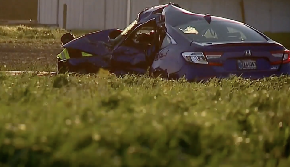 A smashed Honda pictured at a crash scene.