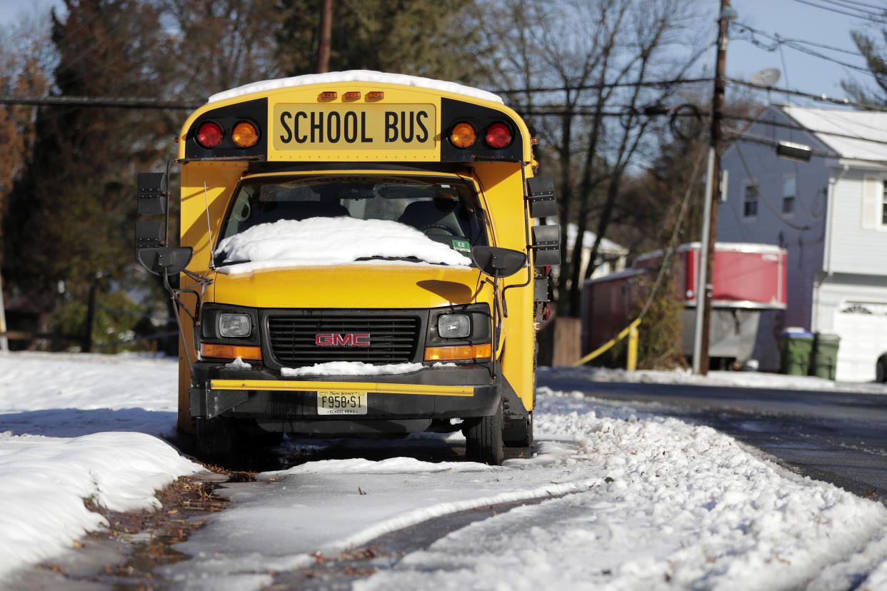 When their bus driver collapsed at the wheel, Nolan Barry, 8, and Thomas MacKeen, 9, took action, steering everyone to safety. (Photo: AP/Julio Cortez)