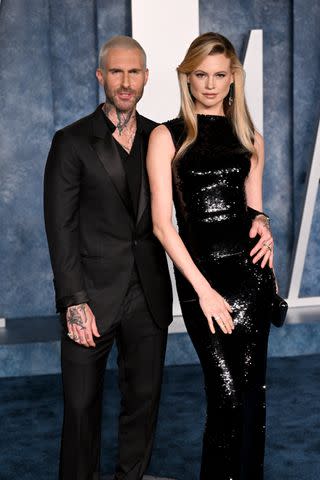 <p>Doug Peters/PA Images via Getty</p> Adam Levine and Behati Prinsloo in Los Angeles on March 12, 2023