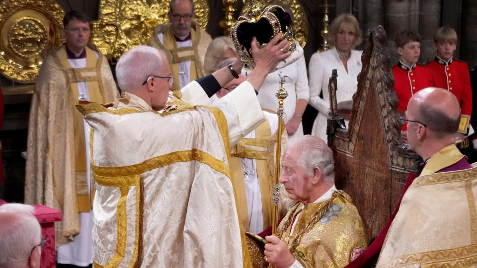 LONDON, ENGLAND - MAY 06: King Charles III is crowned with St Edward's Crown by The Archbishop of Canterbury the Most Reverend Justin Welby during his coronation ceremony in Westminster Abbey on May 6, 2023 in London, England. The Coronation of Charles III and his wife, Camilla, as King and Queen of the United Kingdom of Great Britain and Northern Ireland, and the other Commonwealth realms takes place at Westminster Abbey today. Charles acceded to the throne on 8 September 2022, upon the death of his mother, Elizabeth II.