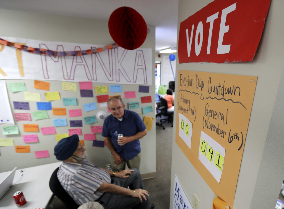 A sign counts down the days to the November election at a gathering at a combined campaign headquarters for Democrats running for office in Redmond, Wash., on the night of Washington state's primary election, Tuesday, Aug. 7, 2018. (AP Photo/Ted S. Warren)