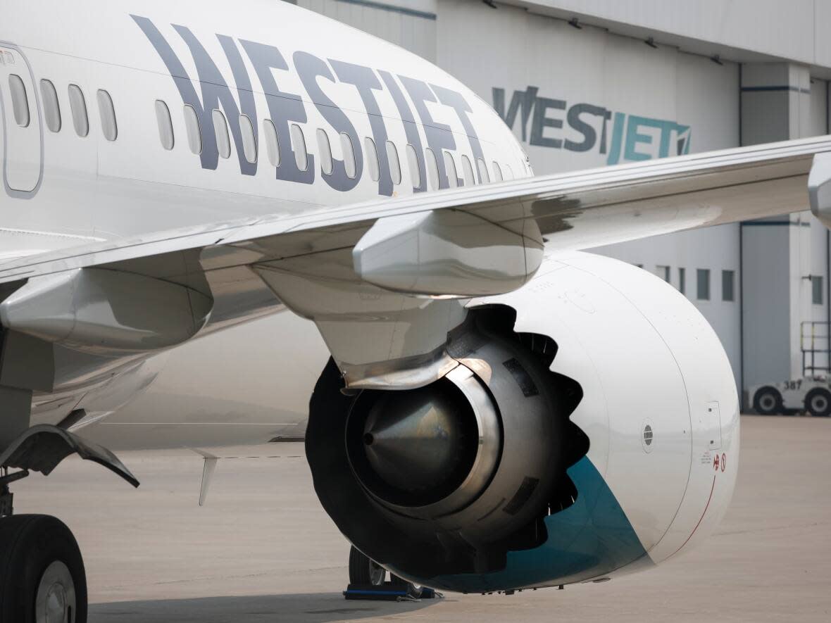 WestJet says it has reached a tentative deal with its aircraft maintenance engineers' union, averting a work stoppage set to begin Tuesday afternoon. (Jeff McIntosh/The Canadian Press - image credit)