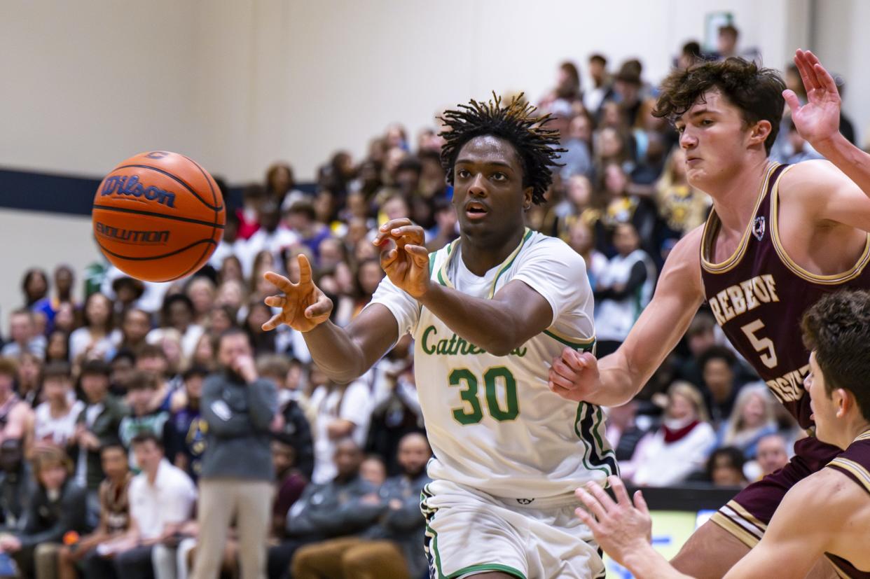 Indianapolis Cathedral High School sophomore Keaton Aldridge (30) fires off a pass to a teammate during the second half of an IHSAA basketball game against Brebeuf Jesuit Preparatory High School, Friday, Dec. 1, 2023, at Cathedral. Cathedral won, 79-63.