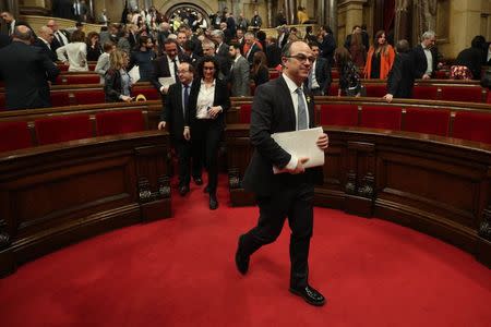 Catalan regional deputy Jordi Turull leaves the chamber at the end of his failed investiture session as new Catalan President at regional parliament in Barcelona, Spain, March 22, 2018. REUTERS/Albert Gea