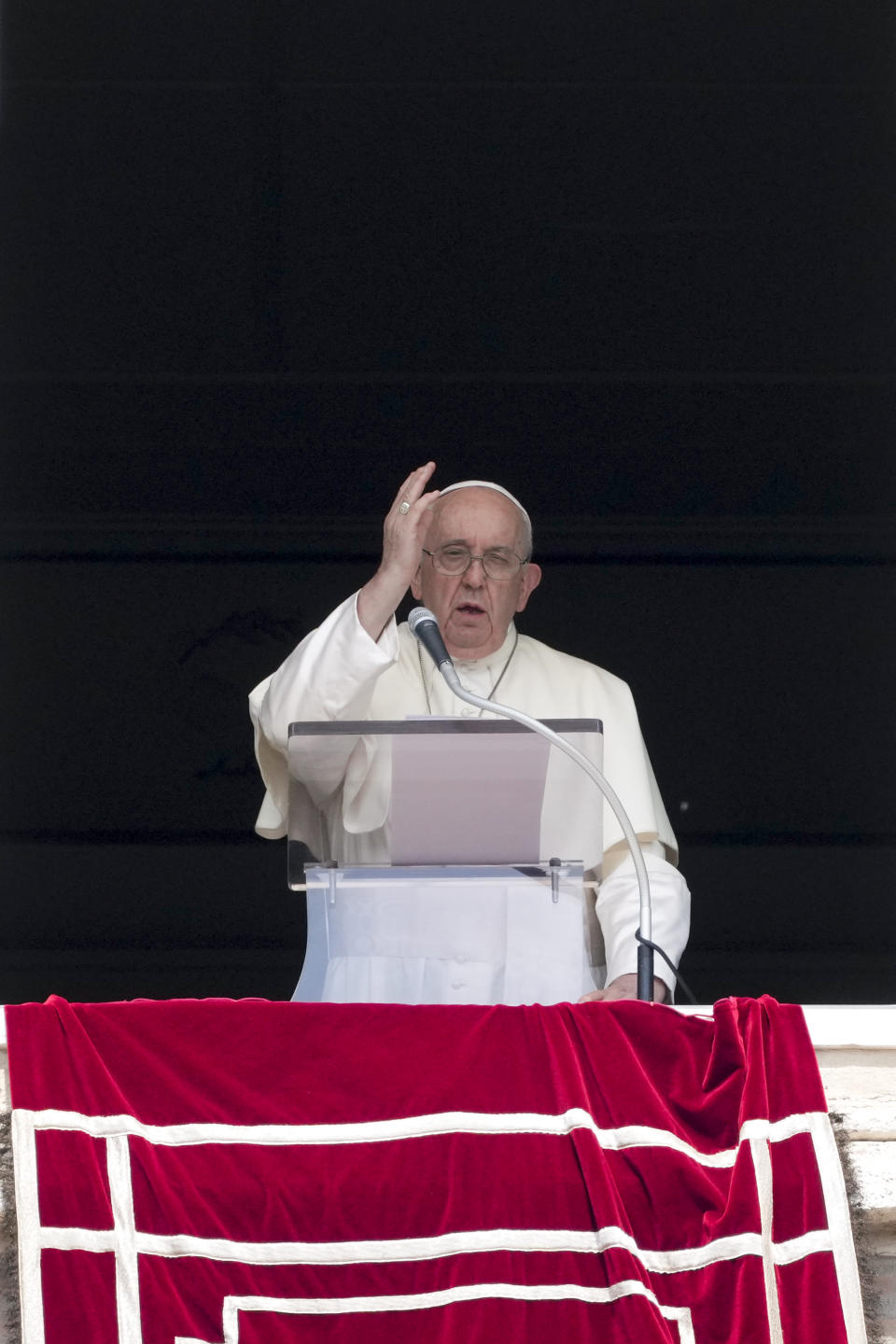 Pope Francis delivers his blessing as he recites the Angelus noon prayer from the window of his studio overlooking St.Peter's Square, at the Vatican, Sunday, Aug. 27, 2023. (AP Photo/Andrew Medichini)