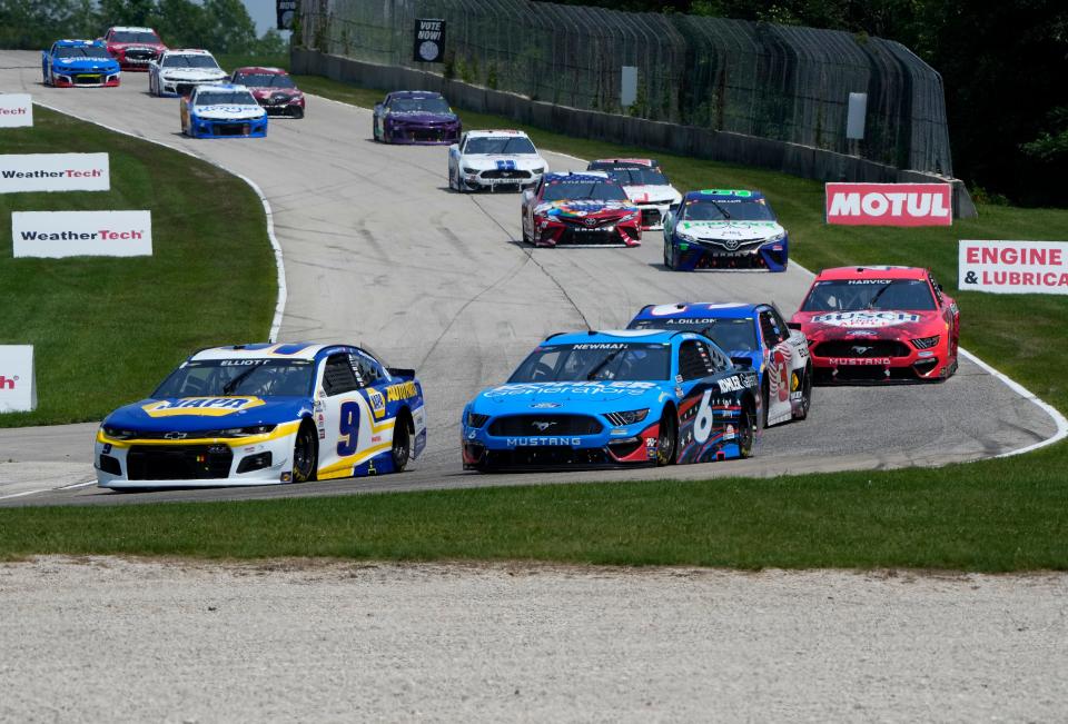 Chase Elliott (9) leads the field during the 2021 NASCAR Cup Series race at Road America.