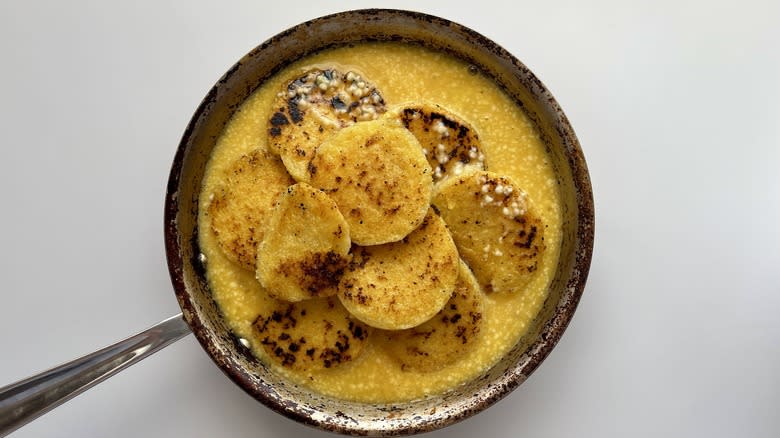 fried polenta and whisked eggs in a skillet