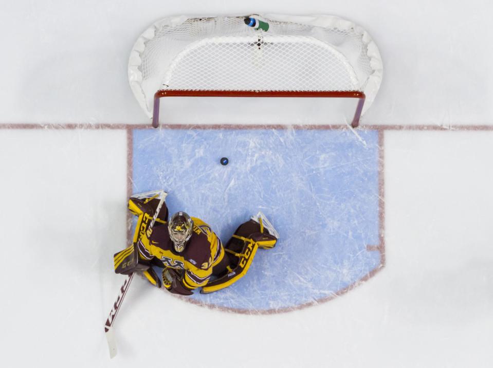 Minnesota's Adam Wilcox looks up after giving up a goal to Union's Shayne Gostisbehere during the first period of an NCAA men's college hockey Frozen Four tournament game on Saturday, April 12, 2014, in Philadelphia. (AP Photo/Chris Szagola)