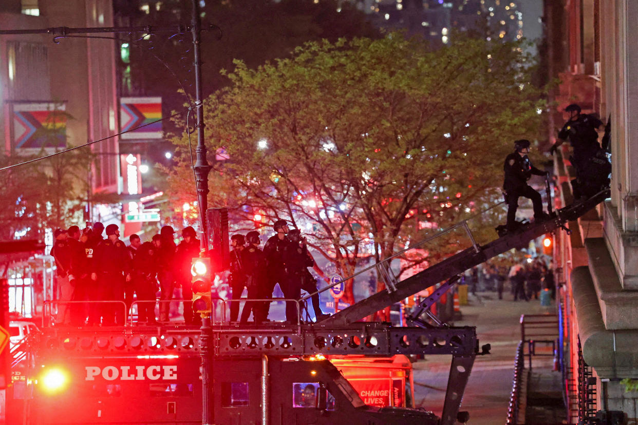 Police personnel use a ramp to enter Hamilton Hall, which was occupied by protesters. 