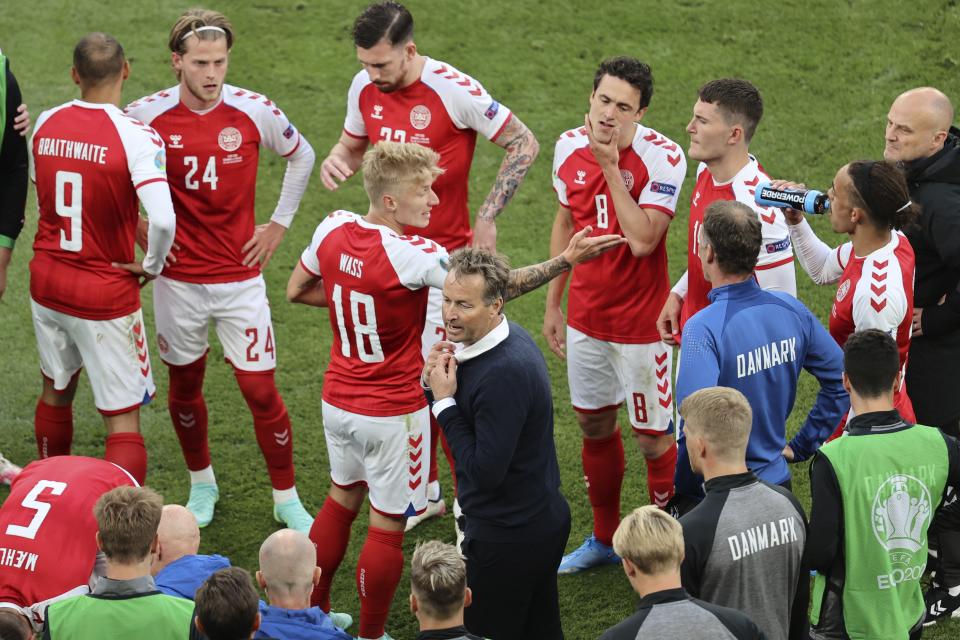 Denmark's manager Kasper Hjulmand instructs his players during the half time of the Euro 2020 soccer championship group B match between Denmark and Finland at Parken stadium in Copenhagen, Denmark, Saturday, June 12, 2021. (Wolfgang Rattay/Pool via AP)