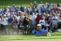 Tiger Woods hits out of the sand to the 15th green during the third round of the Tour Championship golf tournament Saturday, Sept. 22, 2018, in Atlanta. (AP Photo/John Amis)