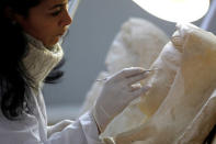 A specialist works on a damaged statue from Palmyra at Syria's National Museum of Damascus, Syria January 9, 2019. Picture taken January 9, 2019. REUTERS/Omar Sanadiki