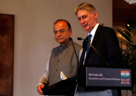 Britain's Chancellor of the Exchequer Philip Hammond (R) and India's Finance Minister Arun Jaitley arrive to address a joint news conference in New Delhi, India April 4, 2017. REUTERS/Altaf Hussain