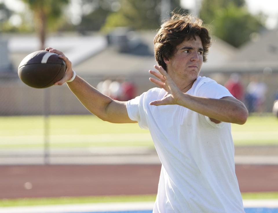Mountain View quarterback Jack Germaine throws during spring football practice in Mesa on May 17, 2023.