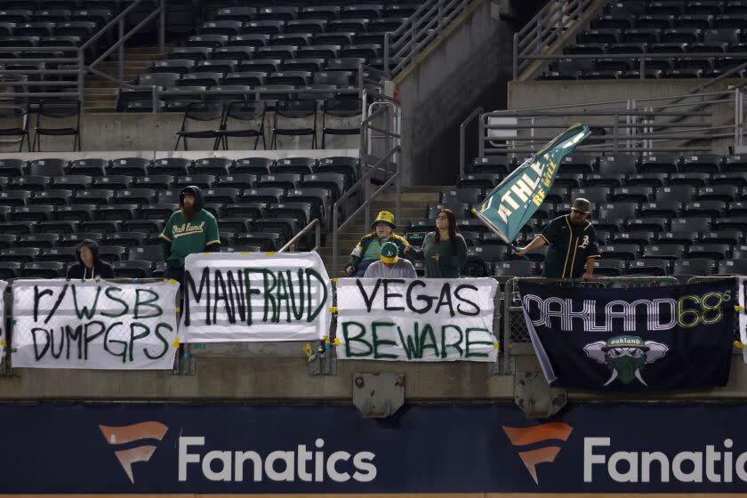 Fans watch a baseball game between the Oakland Athletics and the Arizona Diamondbacks