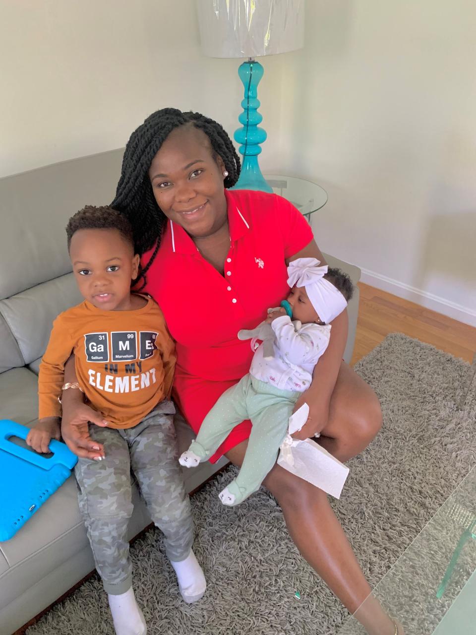 Elli Assiobo-Tipoh of Rochester with her son Zayn, 4, and daughter Zaafirah, 4 months