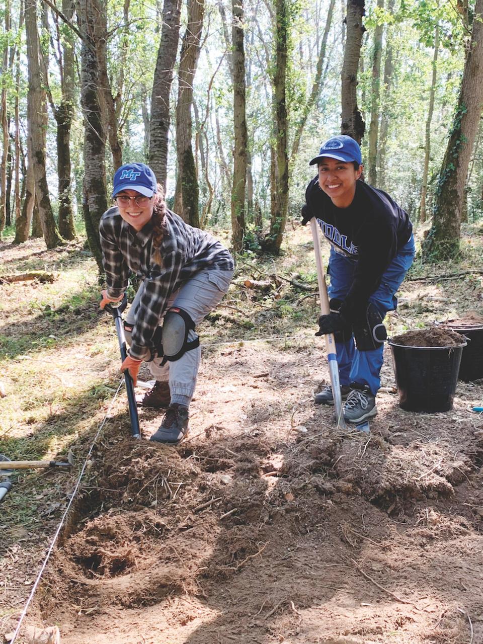 In this 2023 file photo, MTSU students Rose Raymer, left, and Emely Arevalo works a crash site in France as part of a university study abroad group working to help repatriate the remains of tens of thousands of American service personnel who are unaccounted for from past conflicts, many from World War II.