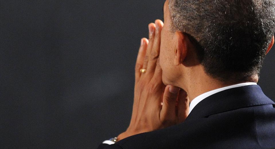 NEWTOWN, CT - DECEMBER 16: U.S. President Barack Obama waits to speak at an interfaith vigil for the shooting victims from Sandy Hook Elementary School on December 16, 2012 at Newtown High School in Newtown, Connecticut. Twenty-six people were shot dead, including twenty children, after a gunman identified as Adam Lanza opened fire at Sandy Hook Elementary School. Lanza also reportedly had committed suicide at the scene. A 28th person, believed to be Nancy Lanza, found dead in a house in town, was also believed to have been shot by Adam Lanza. (Photo by Olivier Douliery-Pool/Getty Images)