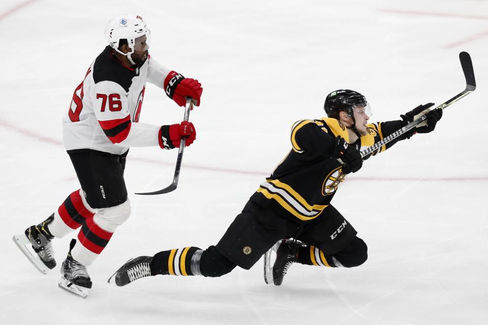 New Jersey Devils' P.K. Subban (76) checks Boston Bruins' Anton Blidh during the second period of an NHL hockey game, Sunday, March 28, 2021, in Boston. (AP Photo/Michael Dwyer)