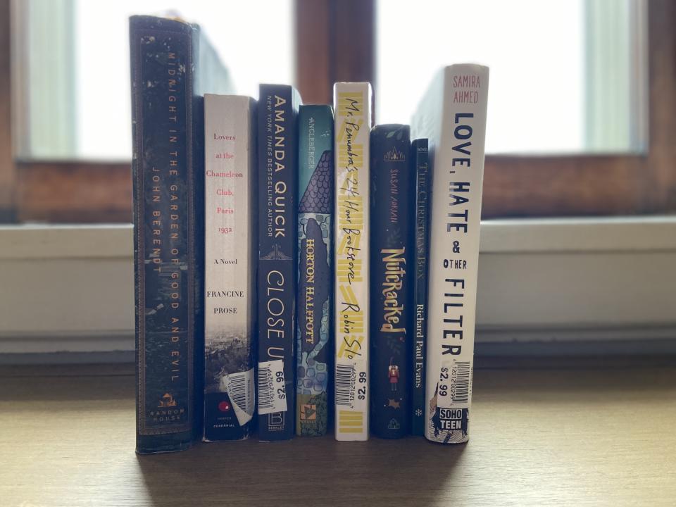 Photo of a line of books including "Midnight in the Garden of Good and Evil," "Lovers at the Chameleon Club," "Close Up, "Horton Halfpott, "Mr. Penumbra's 24-Hour Bookstore, "Nutracked, and "Love, Hate and Other Filter"