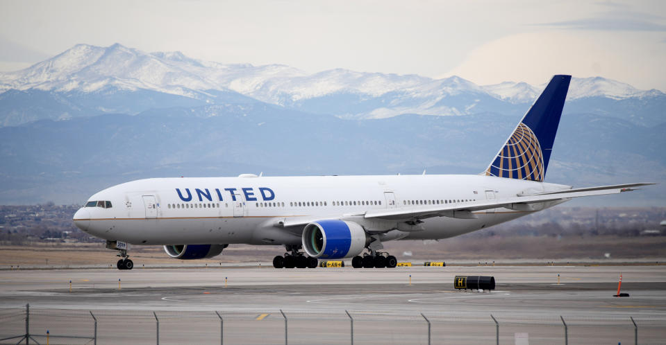 A United Airlines jetliner taxis to a runway for take off in Denver on Dec. 27, 2022.  (David Zalubowski / AP)