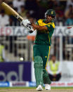 South African cricketer Robin Peterson is clean bowled of Pakistani bowler Junaid Khan during the fifth and final one-day at the Sharjah Cricket Stadium in Sharjah on November 11, 2013. South Africa are winning the five-match series with an unbeatable 3-1 lead. AFP PHOTO/ASIF HASSAN