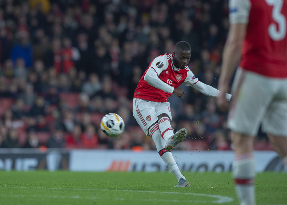 Nicolas Pepe scoring a free kick against Vitoria Guimaraes. (Photo by TF-Images/Getty Images)