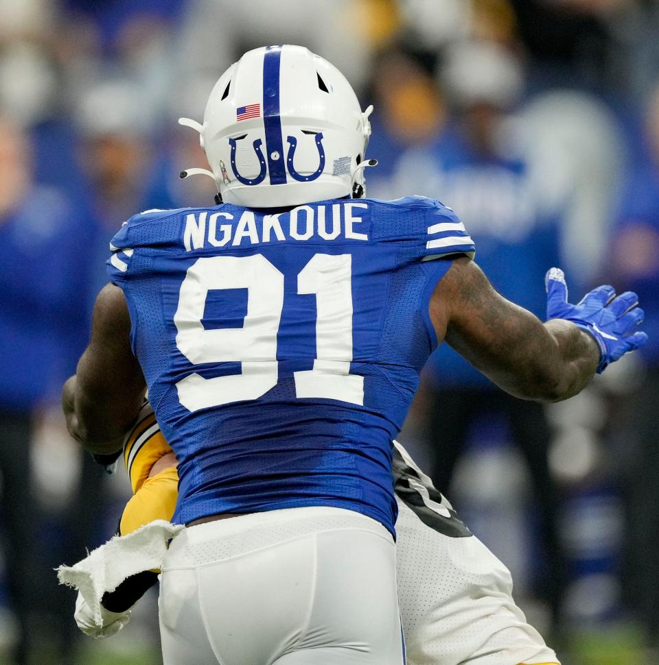 Indianapolis Colts defensive end Yannick Ngakoue (91) moves in to sack <a class="link " href="https://sports.yahoo.com/nfl/teams/pittsburgh/" data-i13n="sec:content-canvas;subsec:anchor_text;elm:context_link" data-ylk="slk:Pittsburgh Steelers;sec:content-canvas;subsec:anchor_text;elm:context_link;itc:0">Pittsburgh Steelers</a> quarterback <a class="link " href="https://sports.yahoo.com/nfl/players/33975" data-i13n="sec:content-canvas;subsec:anchor_text;elm:context_link" data-ylk="slk:Kenny Pickett;sec:content-canvas;subsec:anchor_text;elm:context_link;itc:0">Kenny Pickett</a> (8) on Monday, Nov. 28, 2022, during a game against the Pittsburgh Steelers at Lucas Oil Stadium in Indianapolis.
