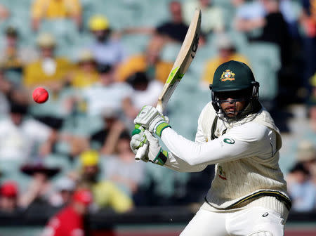 Australia v South Africa - Third Test cricket match - Adelaide Oval, Adelaide, Australia - 25/11/16. Australian batsman Usman Khawaja plays a shot during the second day of the Third Test cricket match in Adelaide. REUTERS/Jason Reed