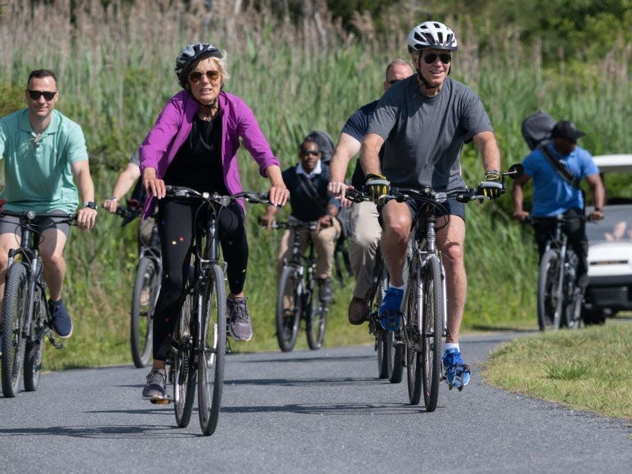 Joe Biden and Jill Biden ride bikes in Rehoboth Beach, Delaware.