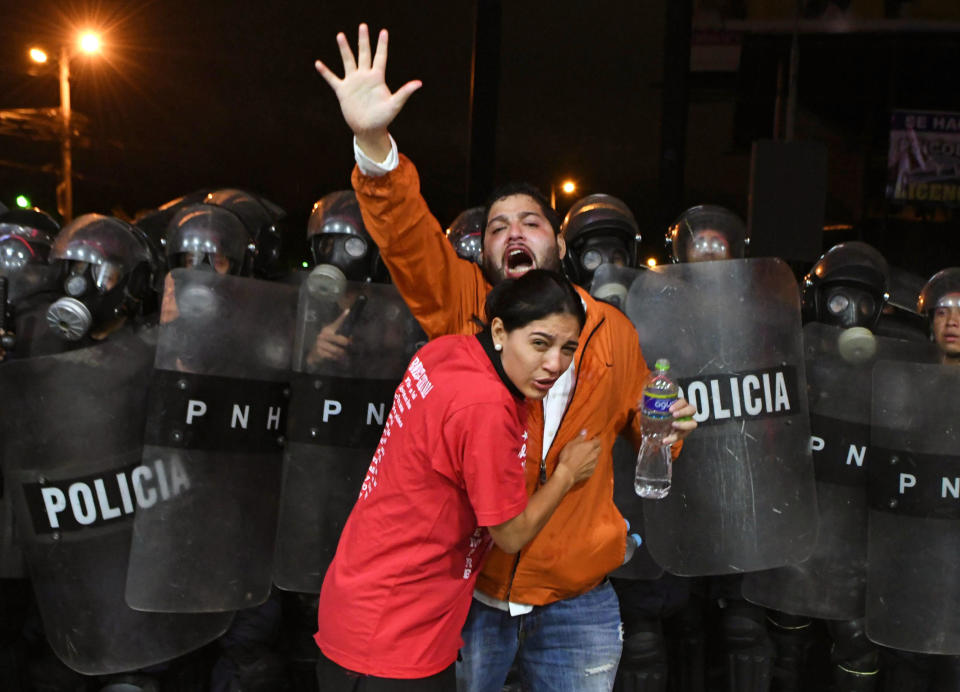 <p>Supporters of Honduran presidential candidate for the Opposition Alliance against the Dictatorship party Salvador Nasralla, are affected by tear gas during a protest outside the Electoral Supreme Court (TSE), to demand the announcement of the election final results in Tegucigalpa, on Nov. 30, 2017. (Photo: Orlando Sierra/AFP/Getty Images) </p>