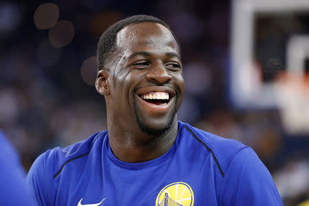 Draymond Green of the Golden State Warriors warms up before his NBA pre-season game against the Denver Nuggets at Oracle Arena in Oakland, California, U.S., September 30, 2017. REUTERS/Stephen Lam