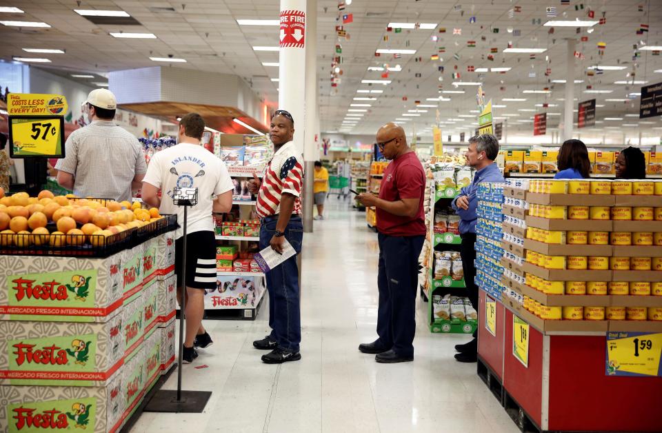 FILE PHOTO: People queue to vote in the midterm elections in a supermarket in Houston, Texas, U.S., November 6, 2018.   REUTERS/Cathal McNaughton