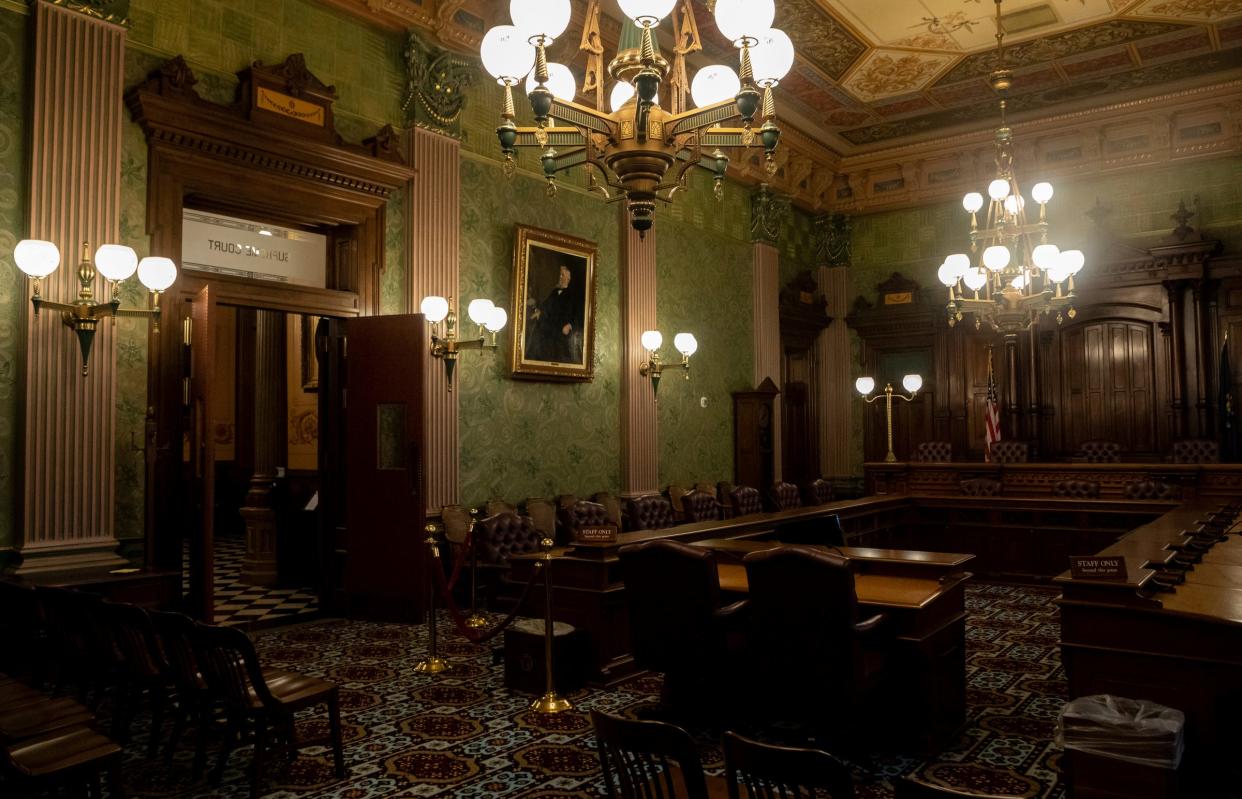 The Supreme Court Chamber sits empty inside the Michigan State Capitol during a school tour in Lansing on Wednesday, Dec. 13, 2023.