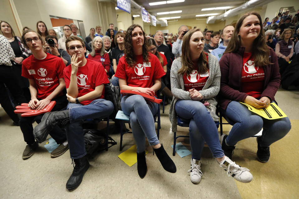 Students listen to Democratic presidential candidate Sen. Kamala Harris speak at the Story County Democrats' annual soup supper fundraiser, Saturday, Feb. 23, 2019, in Ames, Iowa. (AP Photo/Charlie Neibergall)