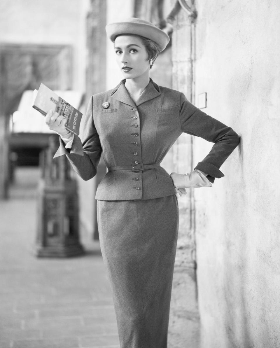 <p>A model wearing a contoured chesterfield suit. </p>