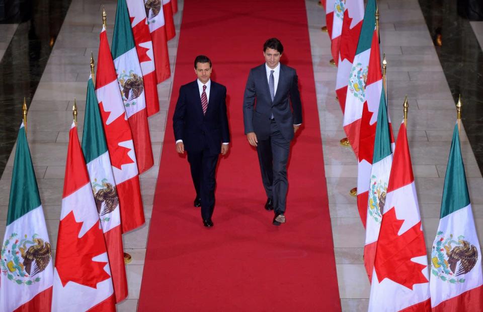 Prime Minister Justin Trudeau and Mexican President Enrique Pena Nieto walk down the Hall of Honour on their way to a signing ceremony on Parliament Hill in Ottawa on Tuesday, June 28, 2016. THE CANADIAN PRESS/Sean Kilpatrick