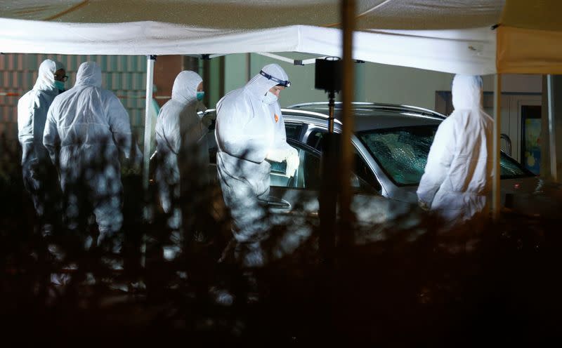 Police forensic officers work at the scene after a car ploughed into a carnival parade injuring several people in Volkmarsen