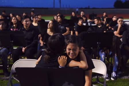 People pay their respects two days after a mass shooting in El Paso