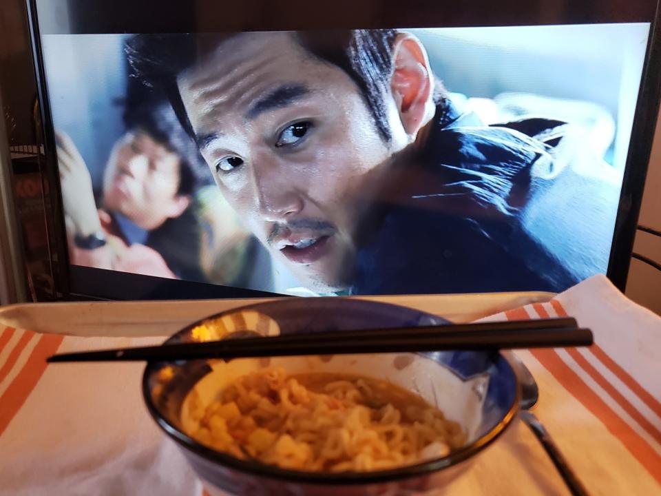 Hyuk Jang as Kang Ji-koo in "The Flu" with a bowl of ramen