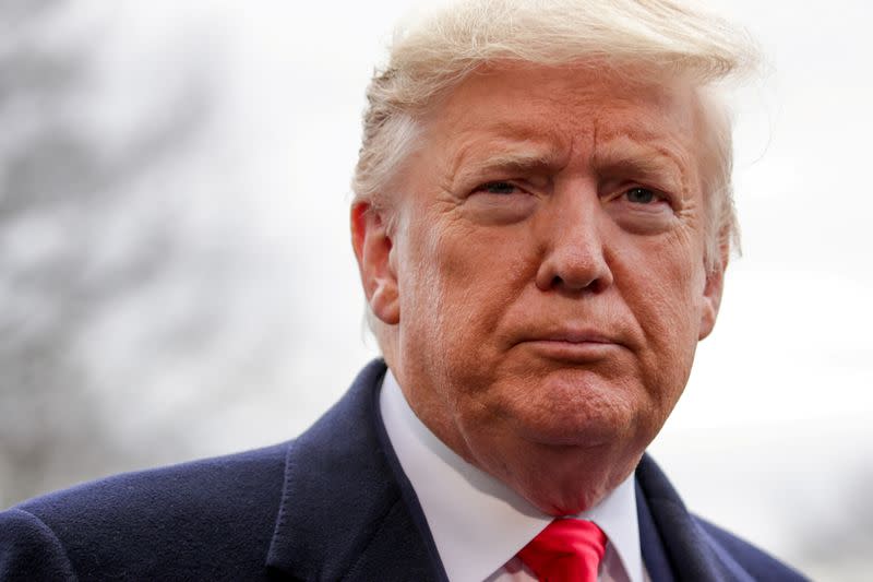 FILE PHOTO: U.S. President Trump speaks to reporters as he departs for travel to North Carolina from Washington