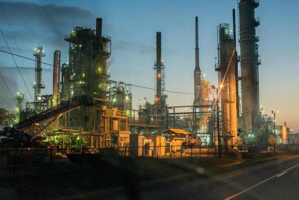 Smoke billows from one of many chemical plants in the area October 12, 2013.