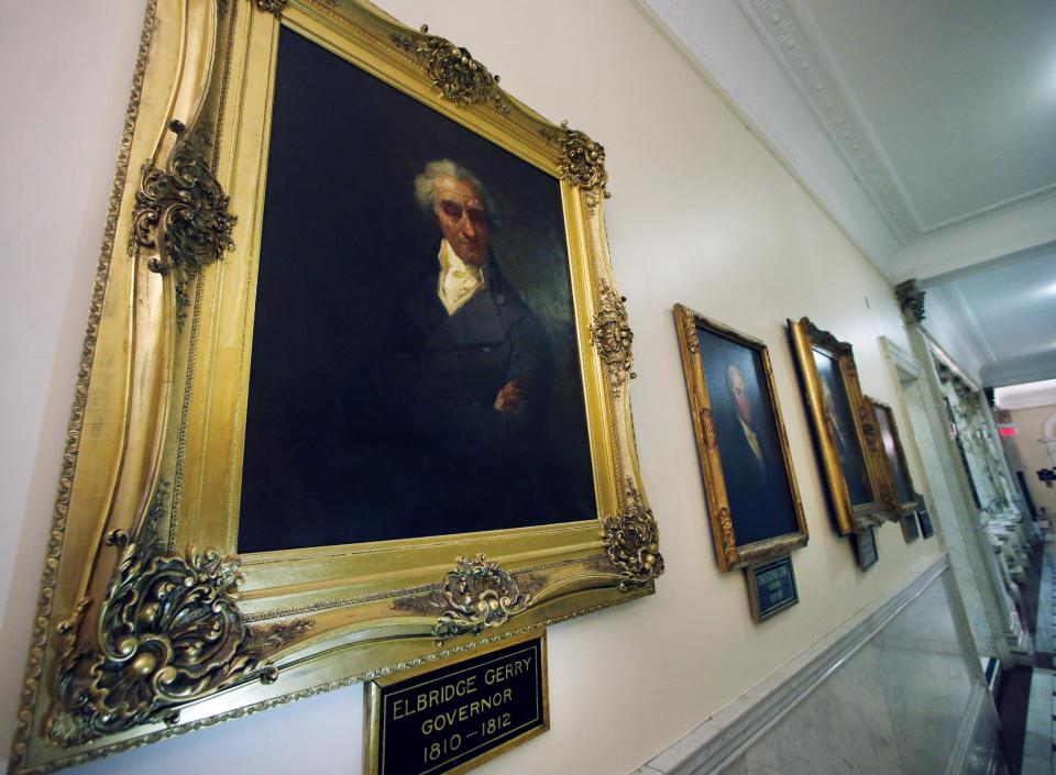 This photo taken March 20, 2014 shows a portrait of Massachusetts Gov. Elbridge Gerry hanging in a hallway at the Statehouse in Boston. For centuries, politicians have been drawing odd-shaped elections districts in an effort to give one political party an advantage over another. In 1812, the practice got a name: gerrymandering. That year, Gov. Gerry signed a bill passed in the Massachusetts legislature to redraw state Senate district map. (AP Photo/Elise Amendola)