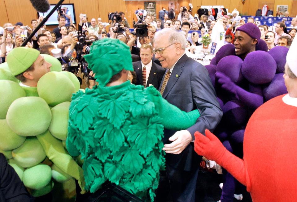 Billionaire investor Warren Buffett thanks performers at the Fruit of the Loom booth, during the annual Berkshire Hathaway shareholders meeting in Omaha, Neb., on May 5, 2007. Fruit of the Loom is a Berkshire Hathaway company.