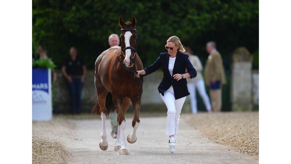  Zara Tindall running beside horse