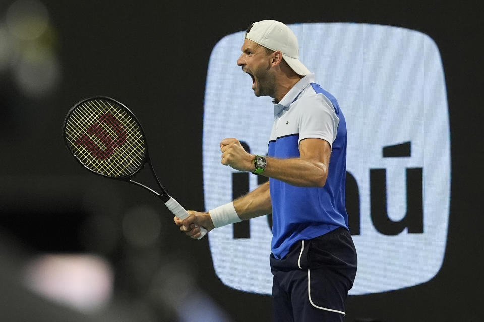 Grigor Dimitrov of Bulgaria celebrates after defeating Carlos Alcaraz of Spain during the Miami Open tennis tournament, Thursday, March 28, 2024, in Miami Gardens, Fla. (AP Photo/Marta Lavandier)