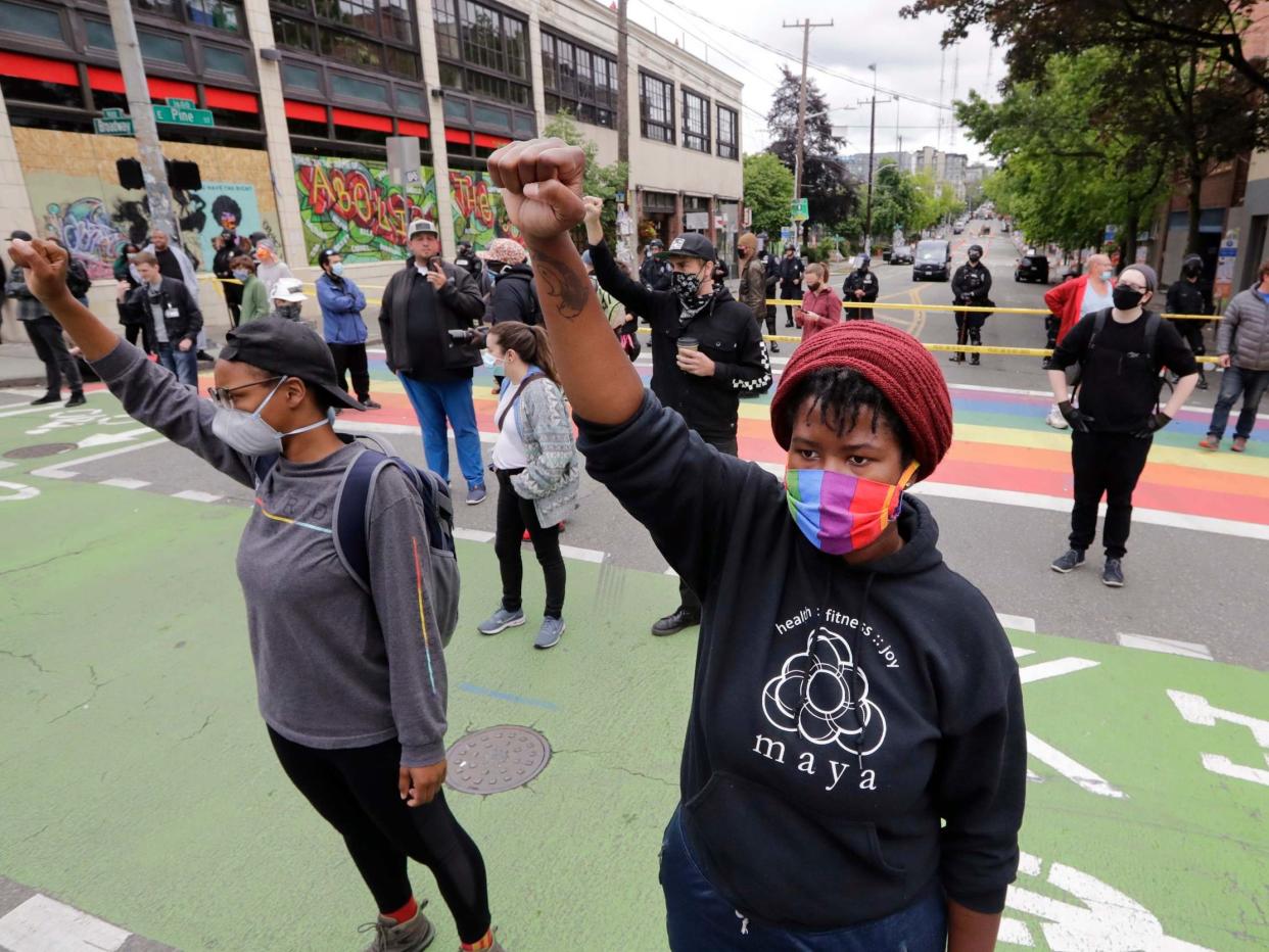 Independent correspondent Andrew Buncombe was arrested while filming police clearing out the protest zone known as Chop in Seattle this week (AP)